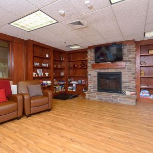 Community room with homelike setting and fireplace