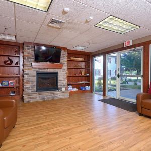 Community room with homelike setting and fireplace